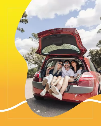 Family loading luggage into a Fetajo hire car at Malaga Airport